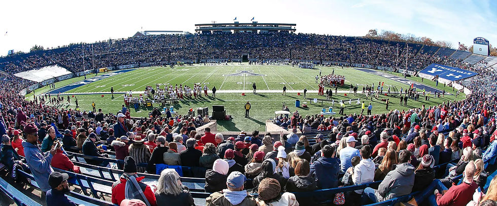 A photo of the Yale football stadium during a game as viewed from the stands.